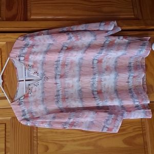 A summer blouse with a cool design on the front and back.